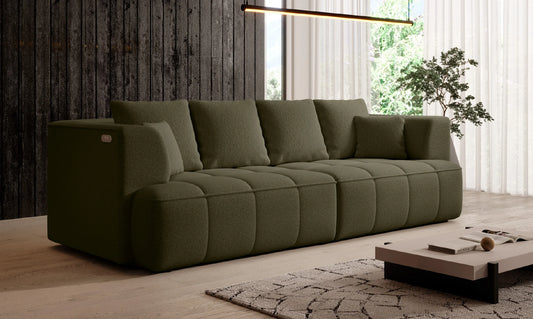 Green Albion sofa bed in a modern living room with wooden floor and large windows.