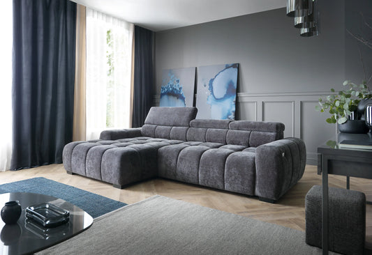 BULL S Gray corner sofa in a living room with decorative elements.