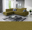 Green sectional Gush III corner sofa bed in a modern living room with a coffee table and decorative pillows.