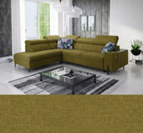 Green sectional Gush III corner sofa bed in a modern living room with a coffee table and decorative pillows.