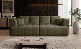 Modern olive green Albion sofa bed  sofa in a living room setting with a coffee table and decorative items.
