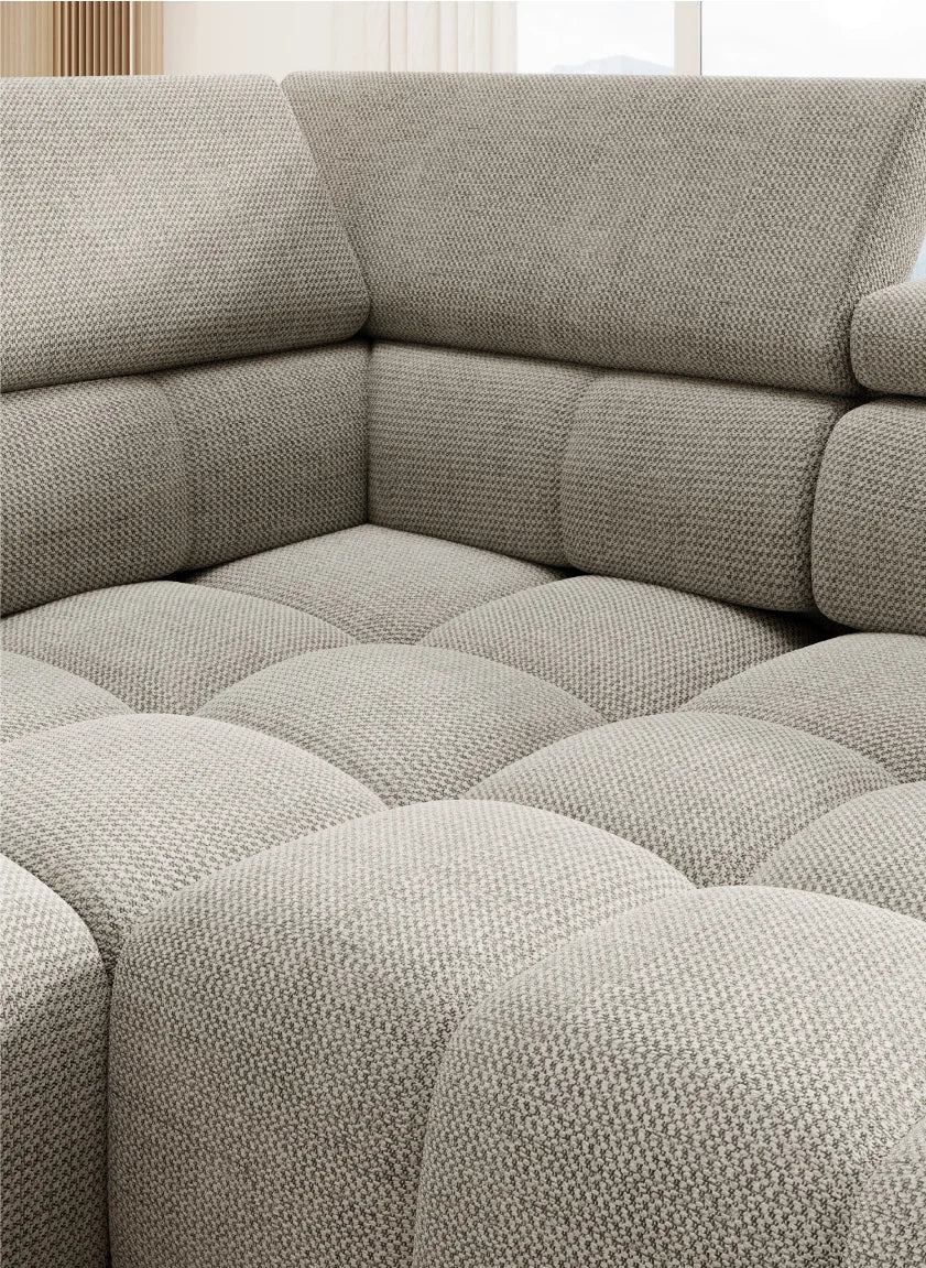 BULL L corner sofa Gray textured fabric sectional sofa in a room with light-colored walls and floor.