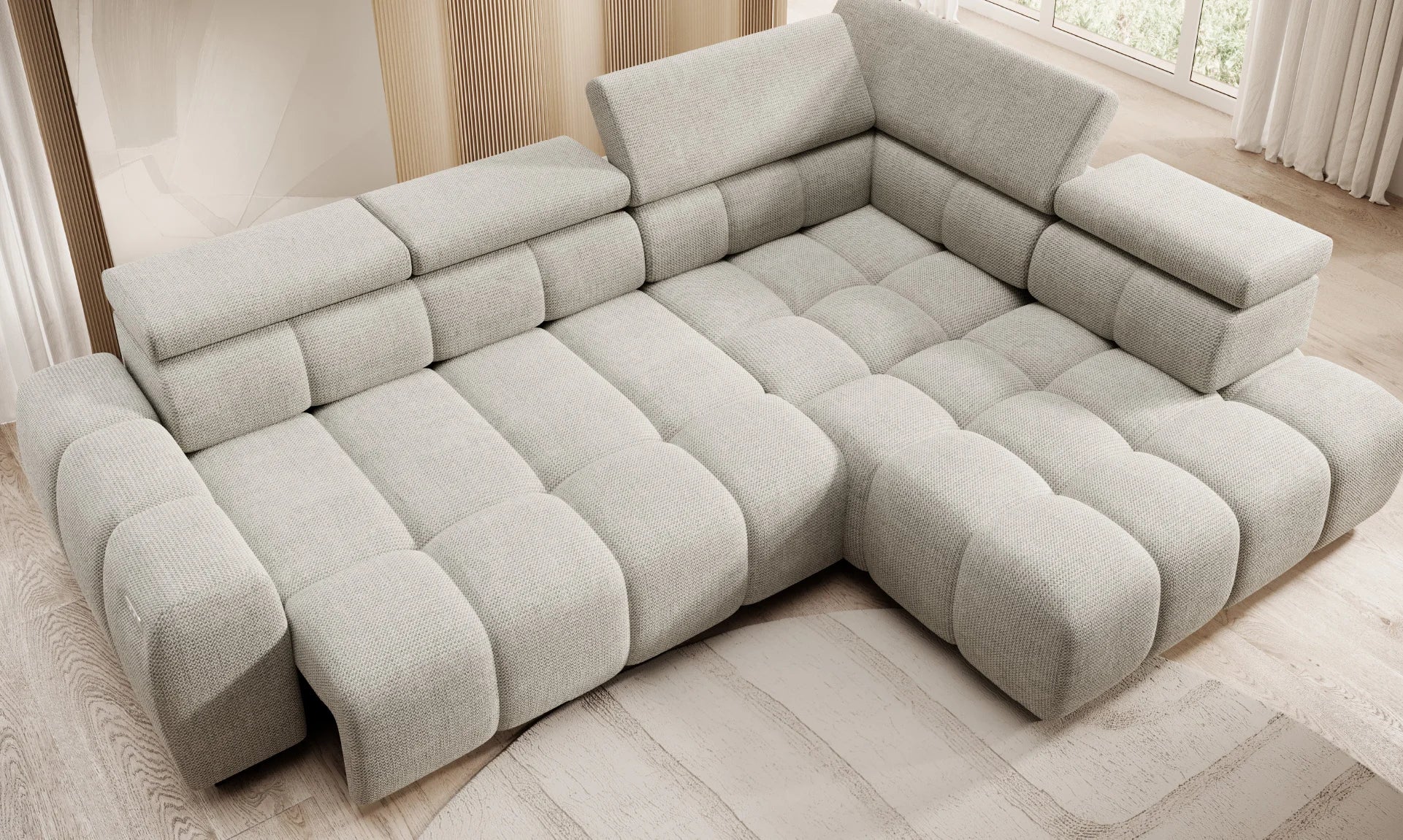 Gray l shaped corner sofa BULL L in a living room setting with light wood flooring and neutral walls.