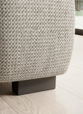 Close-up Bull XL Sofa of a textured fabric surface with a metal leg on a light wood floor.