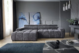 BULL S Gray sectional sofa in a modern living room with abstract art and decor.