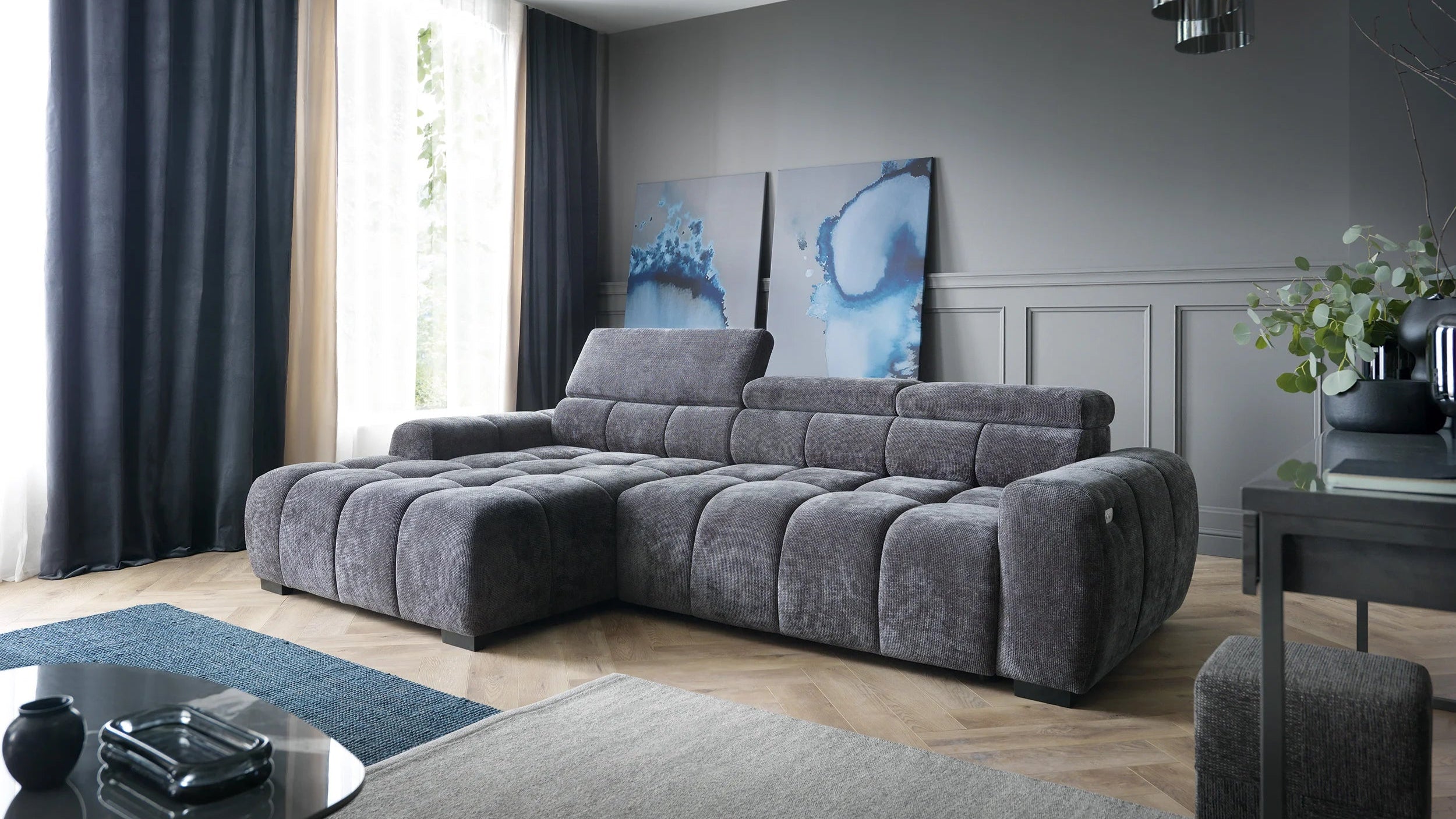 Gray sectional sofa Bull in a living room with decor elements.