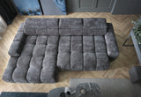 BULL S corner sofa in a living room setting with wooden flooring.