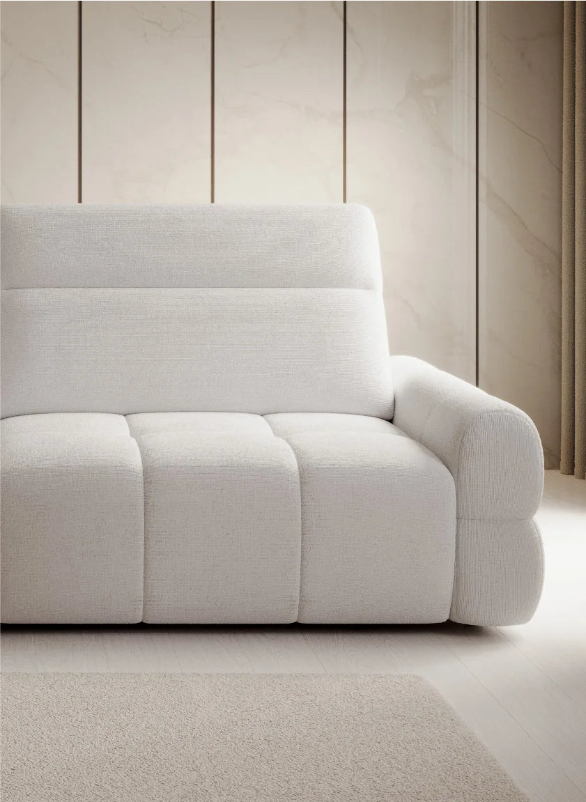 White sofa bed Mateo against a wooden paneled wall