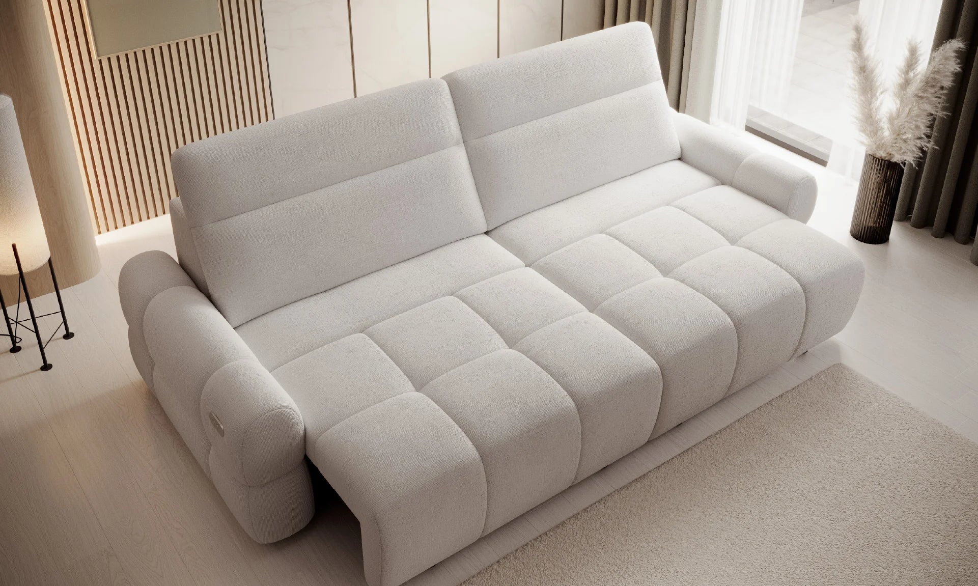 White 4 seater sofa bed Mateoin a room with light-colored walls and decor