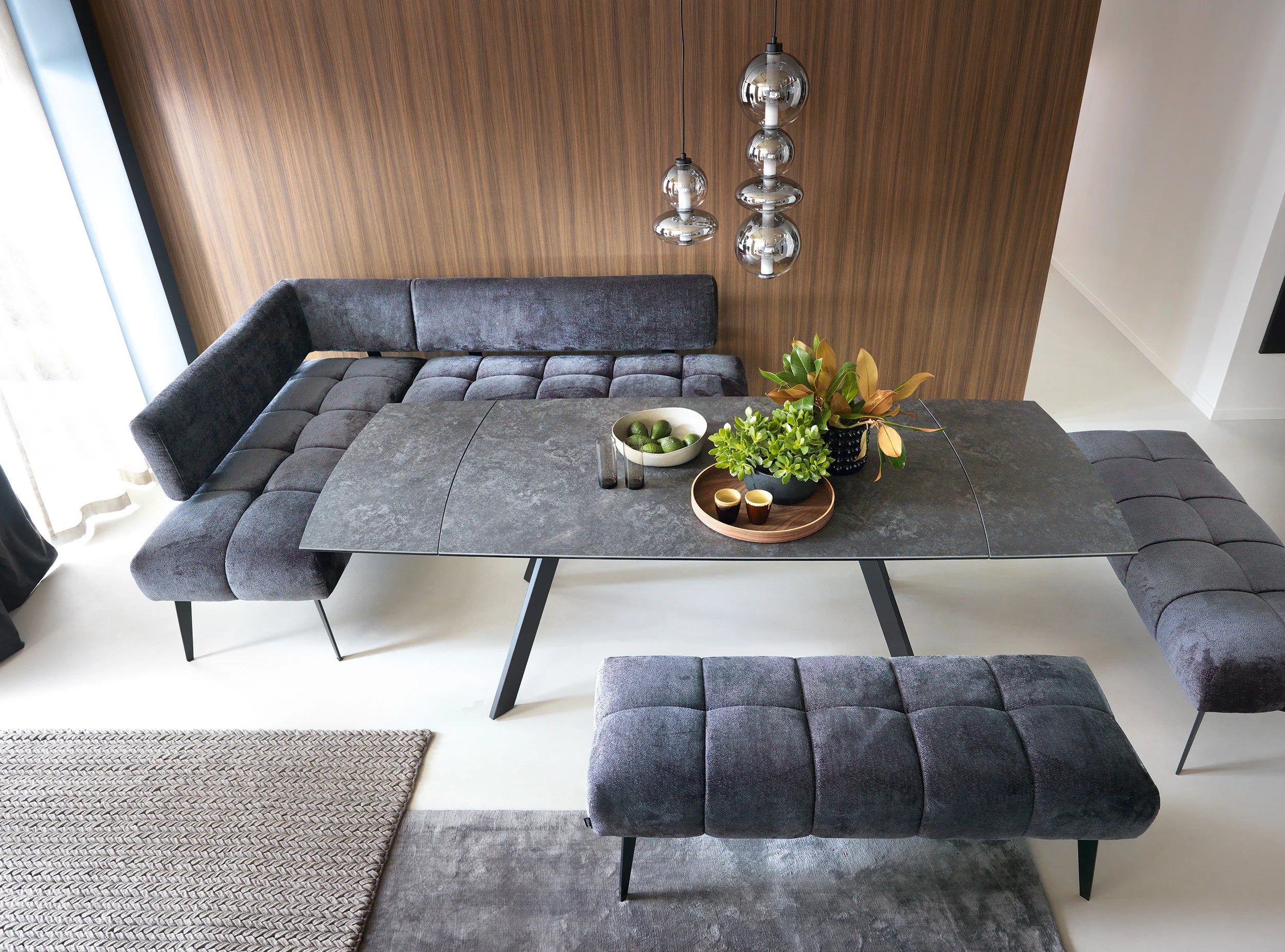 Modern living room with gray Milo dining corners sofa, dining table, and bench.