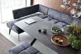 Modern living room with a gray Milo dining corners sofa, coffee table, and decorative items.