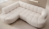 White sectional corner sofa VELPA L with electric seat adjustment, on a wooden floor with a neutral wall in the background