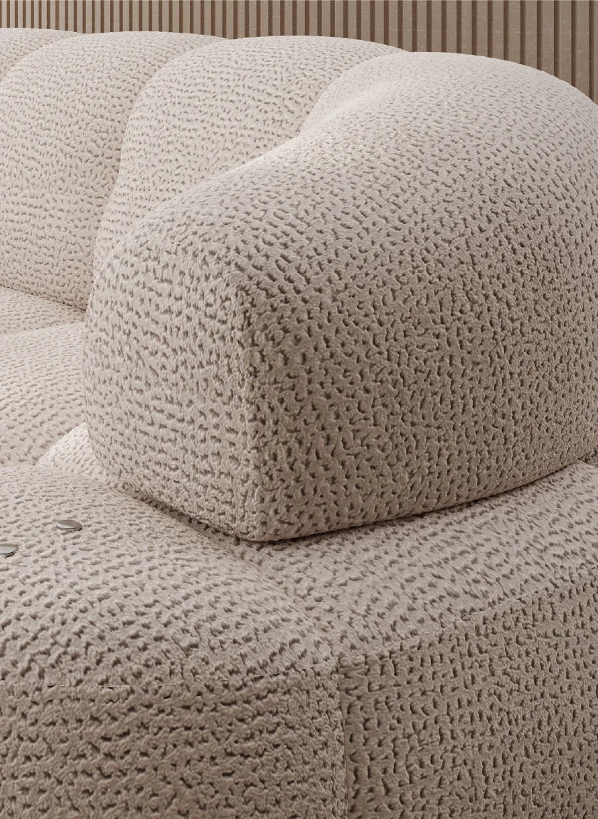 Textured beige corner sofa VELPA L with electric seat adjustment, with a close-up of a cushion