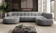 Gray VELPA XL Large U-Shape sofa in a modern living room with a coffee table and decorative items. 