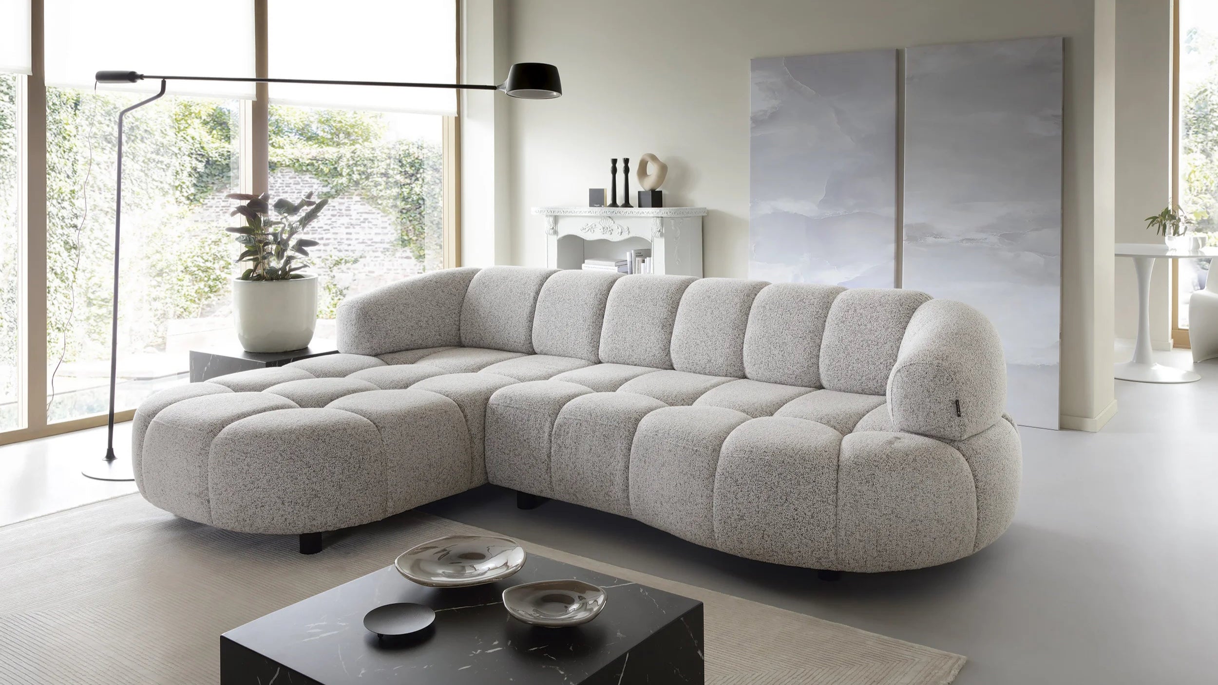 Modern living room with a gray sectional Velpa corner sofa and coffee table.
