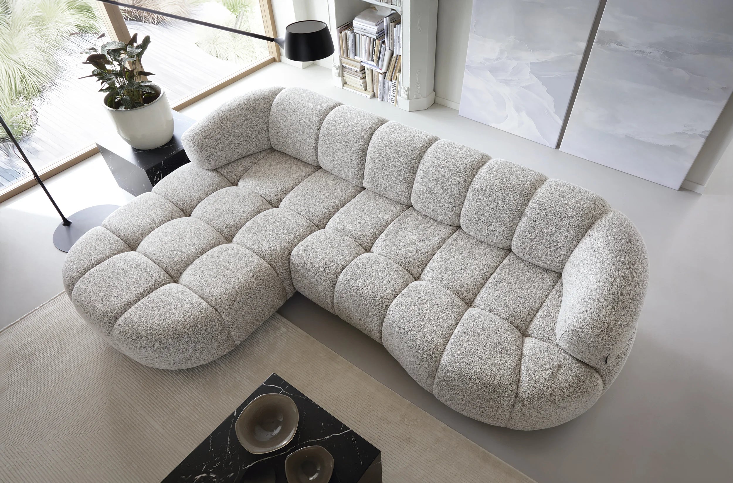VELPA S Modern beige sectional corner sofa in a living room setting with decor elements.