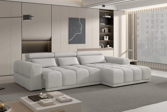 Modern living room with a large gray PANAMA S Power Chaise Corner Sofa with Ottoman and decorative elements.
